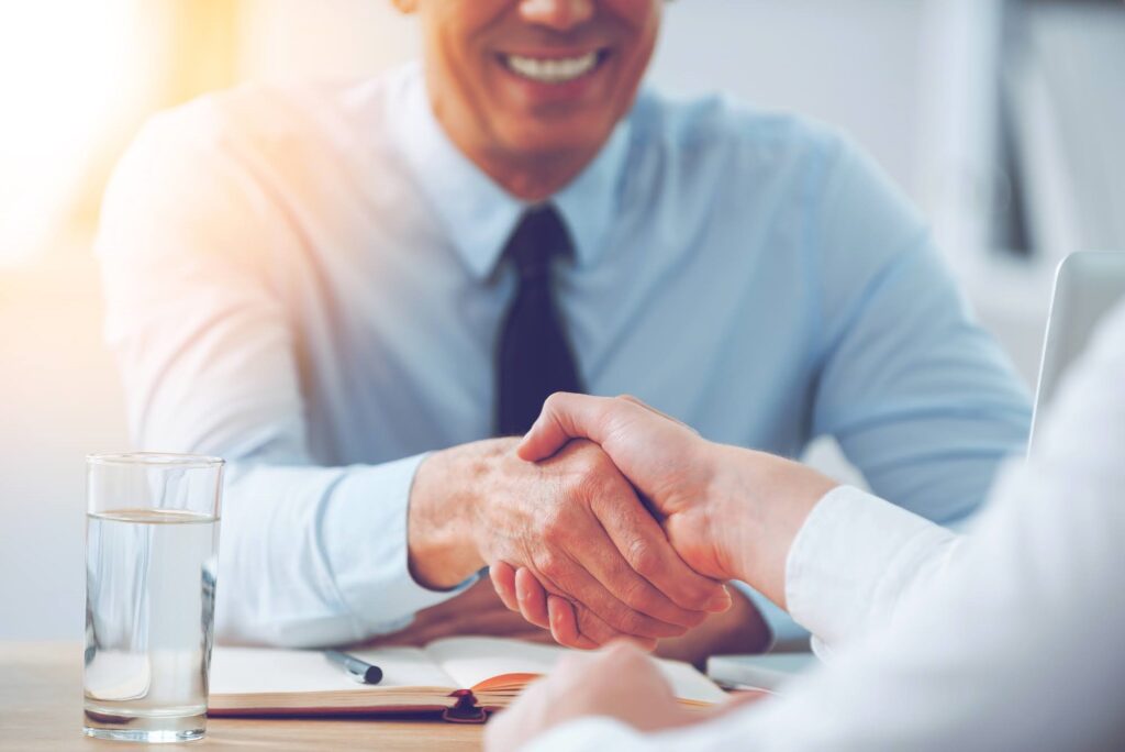 A person shaking hands in a business meeting